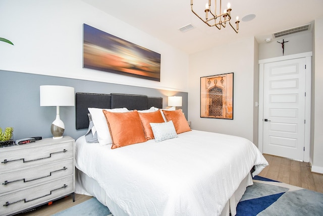 10914 Brambling Wood Dr S, Houston, TX 77043 - bedroom featuring a chandelier and wood finished floors