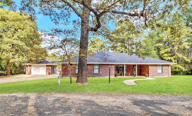 184 Birch, Trinity, TX 75862 - single story home with a front yard, driveway, brick siding, and a garage