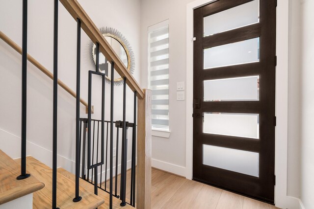 2200 Marnel Rd Unit F, Houston, TX 77055 - foyer entrance featuring wood finished floors, baseboards, and stairs