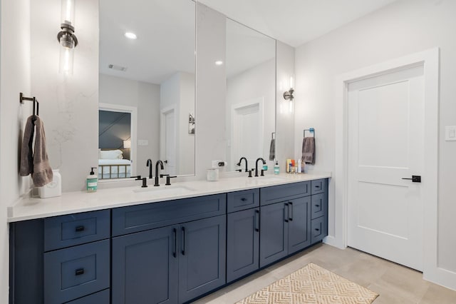2200 Marnel Rd Unit F, Houston, TX 77055 - bathroom with double vanity, connected bathroom, and recessed lighting