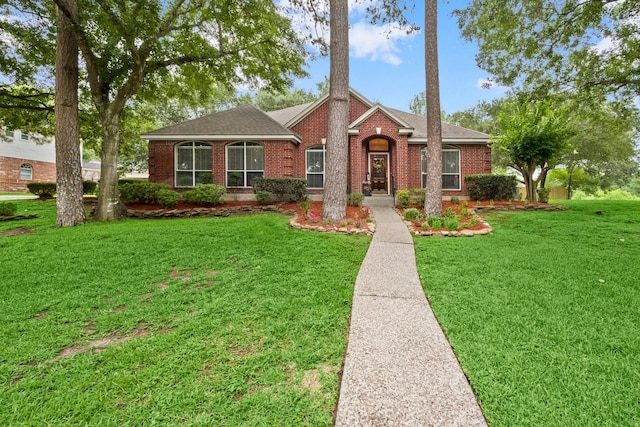 6927 Queensclub Dr, Houston, TX 77069 - view of front of property with brick siding, a front lawn, and a shingled roof