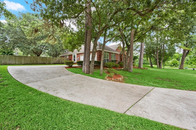 6927 Queensclub Dr, Houston, TX 77069 - view of yard with concrete driveway