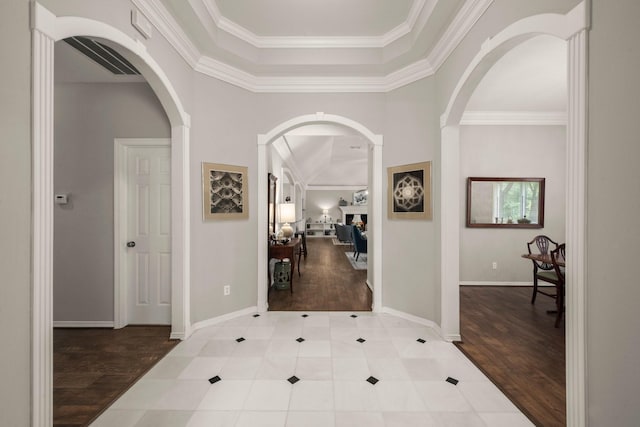 6927 Queensclub Dr, Houston, TX 77069 - entryway featuring ornamental molding, wood finished floors, baseboards, and arched walkways