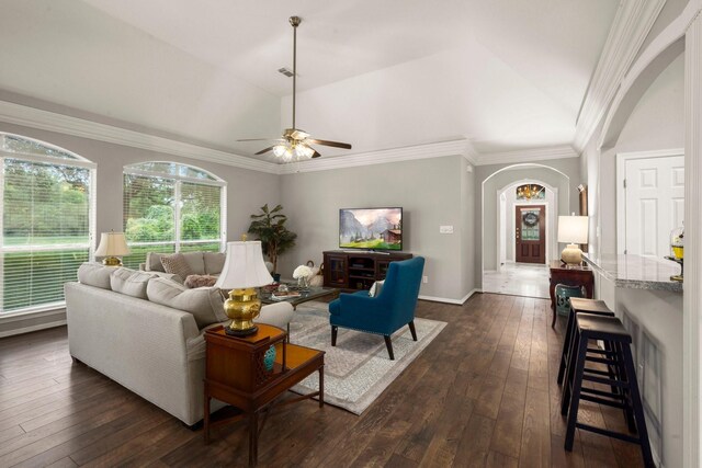 6927 Queensclub Dr, Houston, TX 77069 - living area with arched walkways, lofted ceiling, a ceiling fan, dark wood-style floors, and baseboards