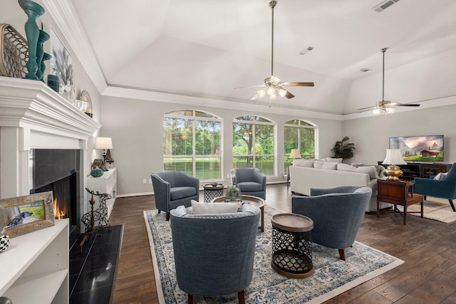 6927 Queensclub Dr, Houston, TX 77069 - living room with lofted ceiling, dark wood-style flooring, ceiling fan, a warm lit fireplace, and ornamental molding