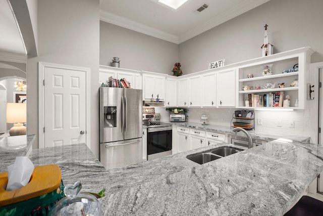 6927 Queensclub Dr, Houston, TX 77069 - kitchen with appliances with stainless steel finishes, crown molding, arched walkways, backsplash, and a sink