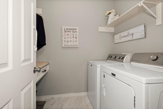6927 Queensclub Dr, Houston, TX 77069 - washroom with independent washer and dryer, baseboards, and light marble finish flooring