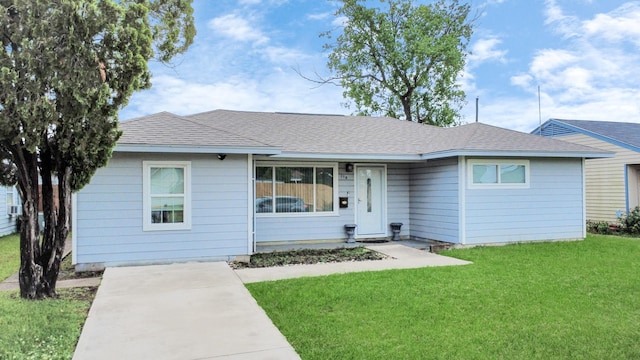 119 Burke Rd, Pasadena, TX 77506 - view of front facade featuring a front yard and roof with shingles