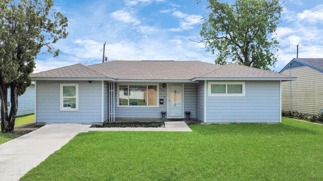 119 Burke Rd, Pasadena, TX 77506 - view of front of home featuring a front lawn and roof with shingles