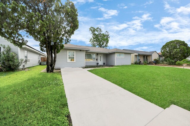 119 Burke Rd, Pasadena, TX 77506 - ranch-style home featuring concrete driveway and a front yard
