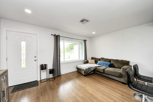 119 Burke Rd, Pasadena, TX 77506 - living area with light wood-type flooring, baseboards, and recessed lighting