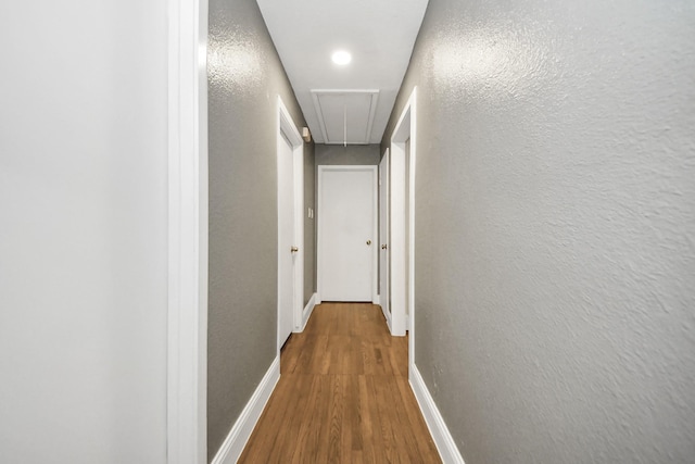 119 Burke Rd, Pasadena, TX 77506 - corridor with attic access, wood finished floors, baseboards, a textured wall, and recessed lighting