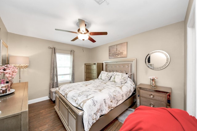 119 Burke Rd, Pasadena, TX 77506 - bedroom with baseboards, dark wood-style flooring, and ceiling fan