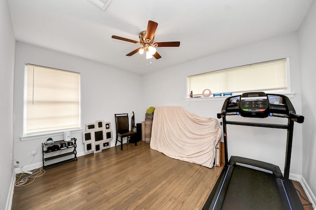 119 Burke Rd, Pasadena, TX 77506 - exercise room featuring wood finished floors, a ceiling fan, and baseboards