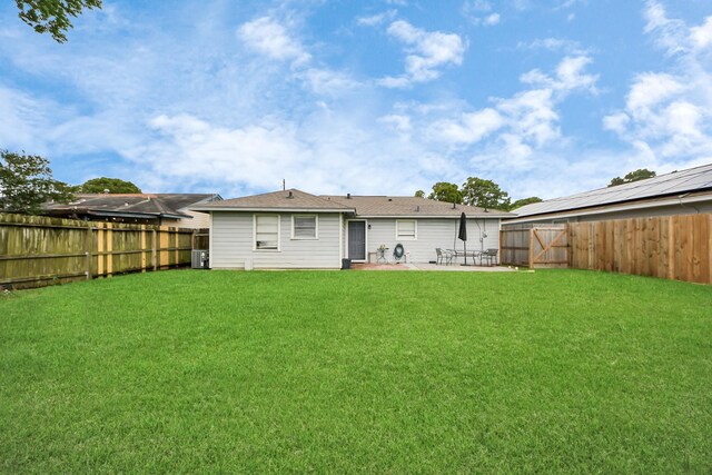 119 Burke Rd, Pasadena, TX 77506 - back of property with a patio area and central AC unit