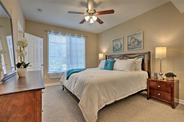 7000 Seawall Blvd Unit 914, Galveston, TX 77551 - bedroom with light colored carpet, baseboards, and a ceiling fan
