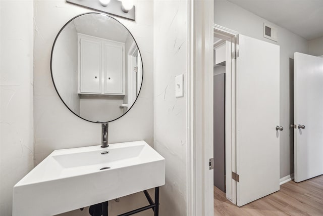 1802 Corral Dr, Houston, TX 77090 - bathroom featuring wood finished floors and a sink