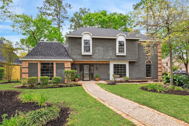 1802 Corral Dr, Houston, TX 77090 - view of front of home with a front lawn, a shingled roof, and brick siding