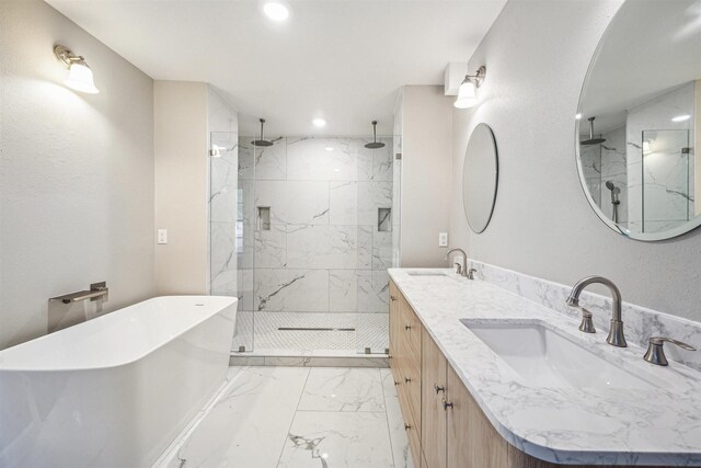 1802 Corral Dr, Houston, TX 77090 - full bath featuring marble look tile flooring, a marble finish shower, double vanity, a soaking tub, and recessed lighting
