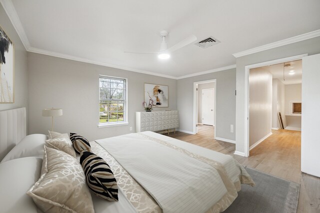 1802 Corral Dr, Houston, TX 77090 - bedroom featuring light wood-style flooring, crown molding, attic access, baseboards, and ceiling fan