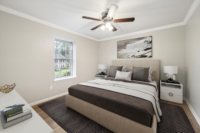 1802 Corral Dr, Houston, TX 77090 - bedroom with wood finished floors, crown molding, baseboards, and ceiling fan