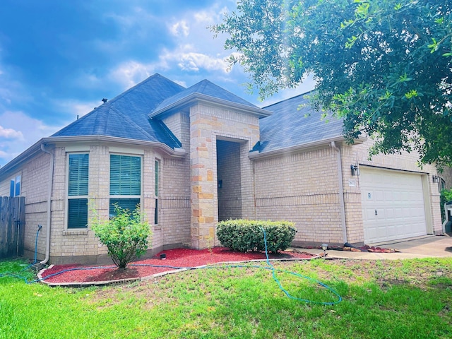 21607 Goloby Dr, Richmond, TX 77407 - view of front of home featuring brick siding, a garage, a shingled roof, and driveway