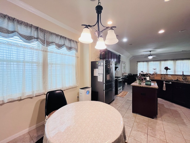 21607 Goloby Dr, Richmond, TX 77407 - dining space featuring crown molding, light tile patterned flooring, a chandelier, healthy amount of natural light, and ceiling fan
