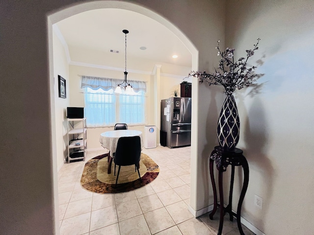 21607 Goloby Dr, Richmond, TX 77407 - hallway with arched walkways, light tile patterned floors, ornamental molding, a chandelier, and recessed lighting