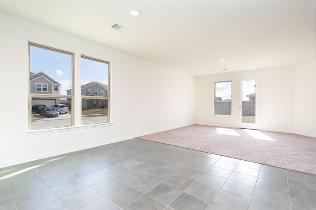 6120 Whitewing Rd, Rosenberg, TX 77469 - unfurnished room featuring carpet flooring, baseboards, tile patterned floors, and recessed lighting