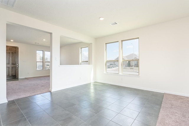 6120 Whitewing Rd, Rosenberg, TX 77469 - unfurnished room with dark tile patterned floors, recessed lighting, baseboards, and dark carpet