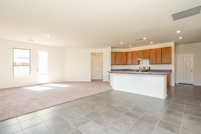 6120 Whitewing Rd, Rosenberg, TX 77469 - kitchen with light carpet, recessed lighting, open floor plan, and baseboards