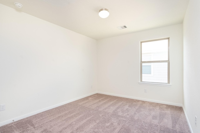 6120 Whitewing Rd, Rosenberg, TX 77469 - spare room with light carpet, a smoke detector, and baseboards
