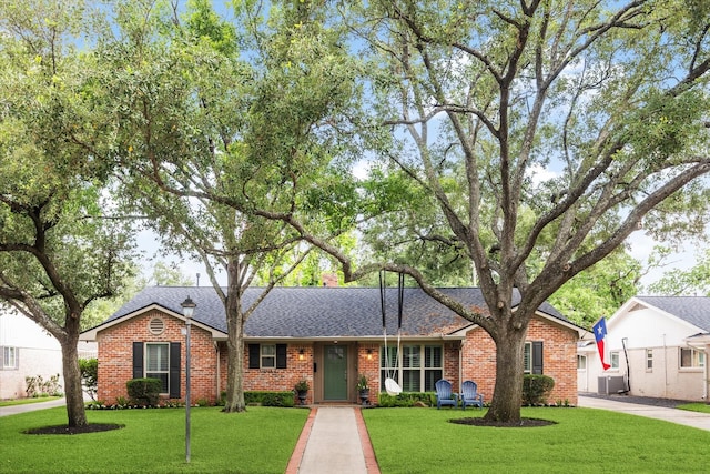10043 Overbrook Ln, Houston, TX 77042 - single story home with brick siding, a front yard, and a shingled roof