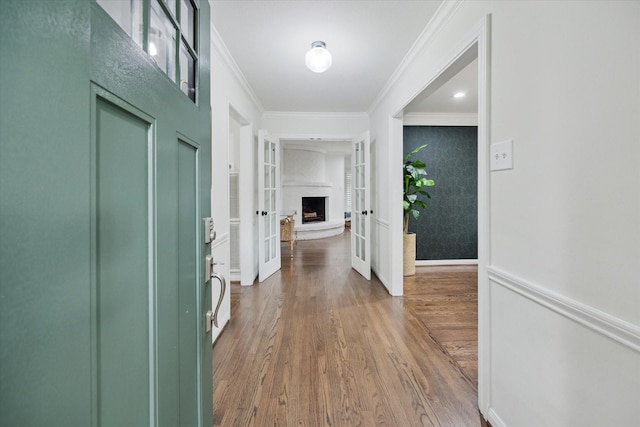 10043 Overbrook Ln, Houston, TX 77042 - corridor featuring crown molding, french doors, and wood finished floors