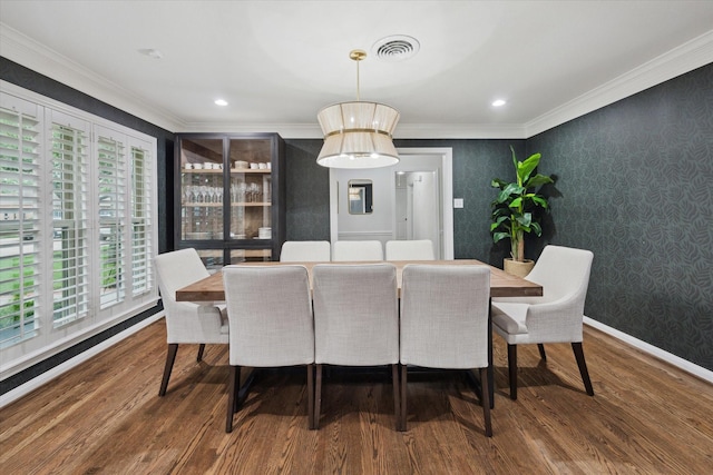 10043 Overbrook Ln, Houston, TX 77042 - dining space with wood finished floors, crown molding, wallpapered walls, recessed lighting, and baseboards