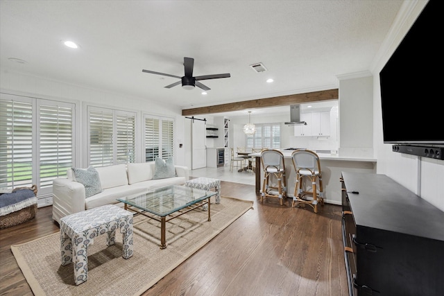 10043 Overbrook Ln, Houston, TX 77042 - living room with a ceiling fan, crown molding, dark wood-type flooring, and recessed lighting