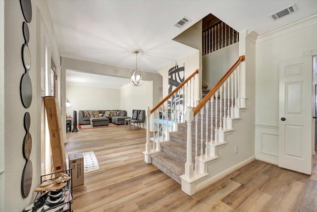 3602 Garrettsville Dr, Pearland, TX 77584 - entryway featuring light wood-style flooring, stairway, baseboards, and crown molding