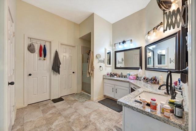 3602 Garrettsville Dr, Pearland, TX 77584 - bathroom featuring vanity, a stall shower, and baseboards