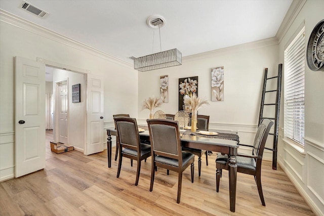 3602 Garrettsville Dr, Pearland, TX 77584 - dining area featuring crown molding and light wood finished floors