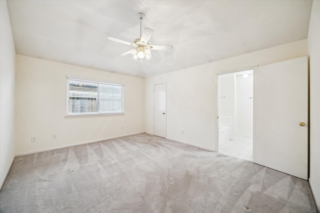 2818 Cocona Ln, Houston, TX 77073 - unfurnished bedroom with carpet, baseboards, ensuite bathroom, and ceiling fan