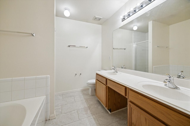 2818 Cocona Ln, Houston, TX 77073 - bathroom with a stall shower, double vanity, a garden tub, toilet, and baseboards