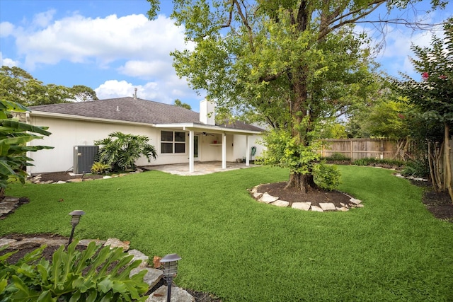 2818 Cocona Ln, Houston, TX 77073 - back of house with ceiling fan, a patio area, central air condition unit, and a chimney
