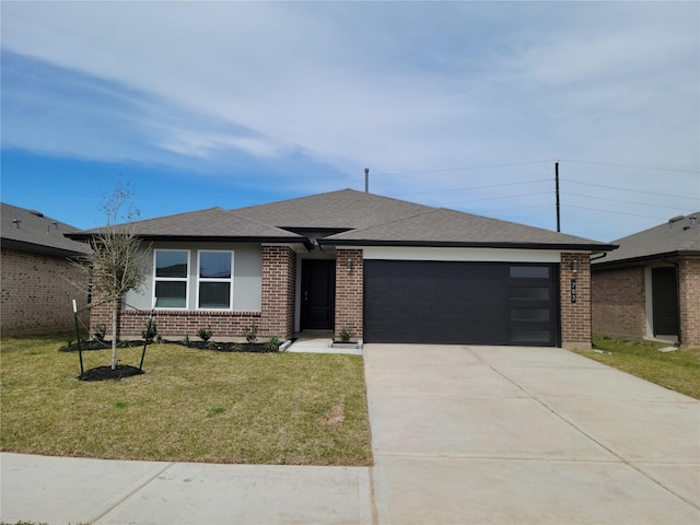 703 Alpine Falls Rd, Rosharon, TX 77583 - view of front of property with a garage, driveway, brick siding, a front yard, and a shingled roof