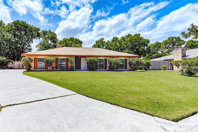 4430 Peridot Ln, Friendswood, TX 77546 - view of front of home featuring driveway, a chimney, and brick siding