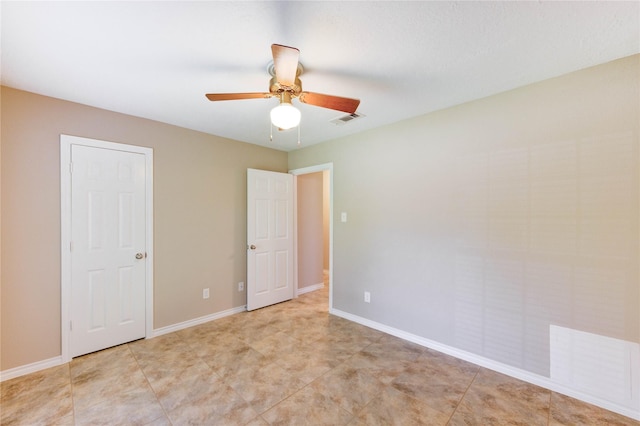 4430 Peridot Ln, Friendswood, TX 77546 - unfurnished bedroom with a ceiling fan and baseboards