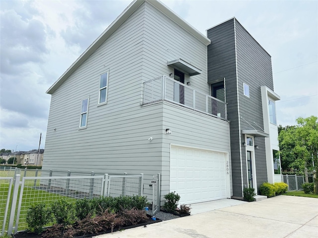 2806 Rosefield Dr, Houston, TX 77080 - view of home's exterior with a balcony, driveway, and an attached garage