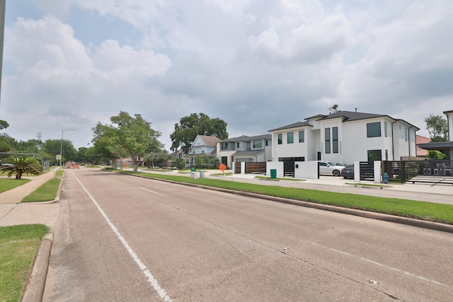 6514 Westview Dr, Houston, TX 77055 - view of concrete street featuring curbs, street lights, and sidewalks