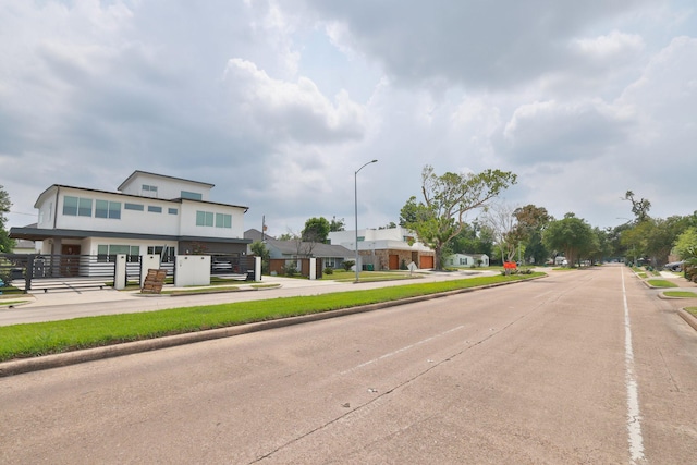 6514 Westview Dr, Houston, TX 77055 - view of concrete street featuring curbs, street lights, and sidewalks