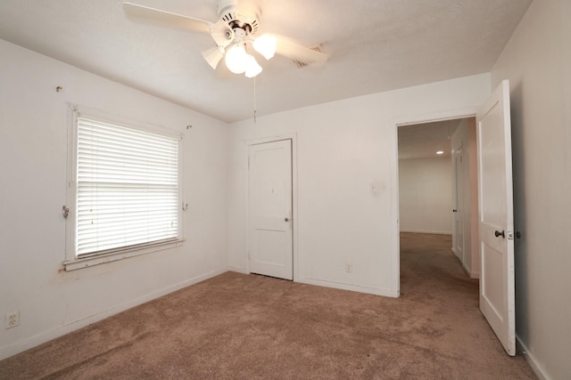 6514 Westview Dr, Houston, TX 77055 - unfurnished bedroom with carpet, baseboards, and a ceiling fan