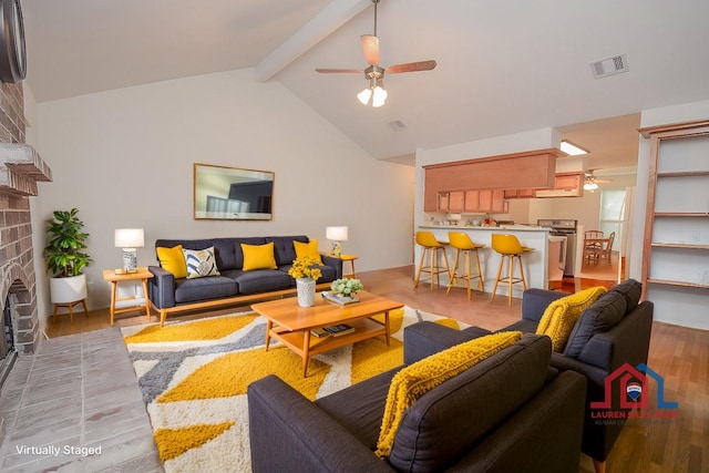 3 Lazybrook St, Angleton, TX 77515 - living room featuring a ceiling fan, a brick fireplace, and light wood-style flooring